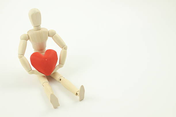 istock Quiet Wooden Figure Expressing Love. 2225957308