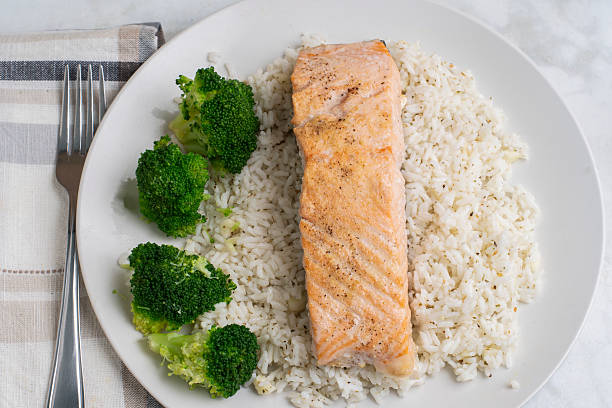 istock baked salmon  on rice with broccoli 2225958604