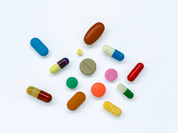 istock Colorful Capsules and Tablets on White Background 2225964962