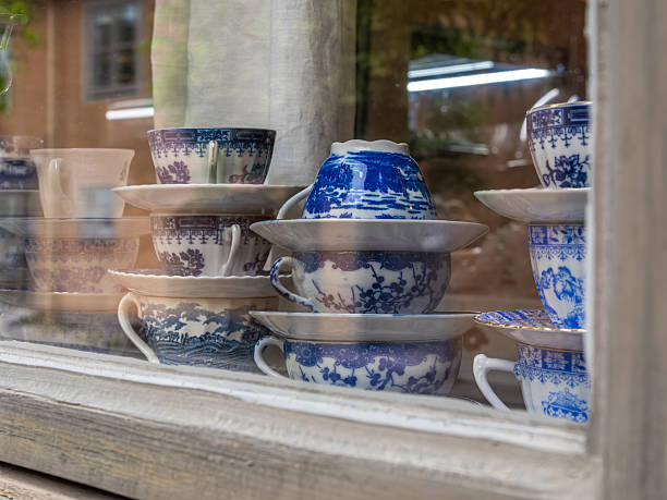istock Decorative Blue and White Porcelain Teacups in Shop Window 2225965568