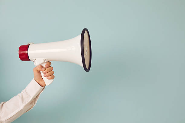 istock Man hand with loudspeaker make announcement 2225966407