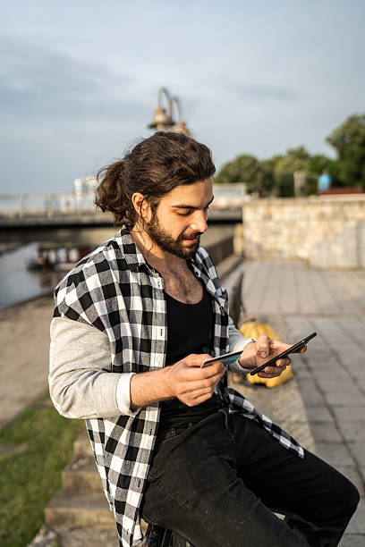istock Young man making online payment using credit card and smartphone 2225967039