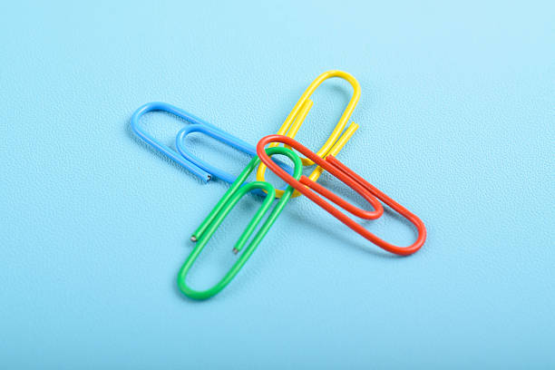 istock Paper clips isolated on light blue background 2225971912