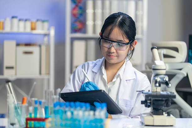 istock Female students are experimenting and researching chemistry in a modern classroom. 2225972442