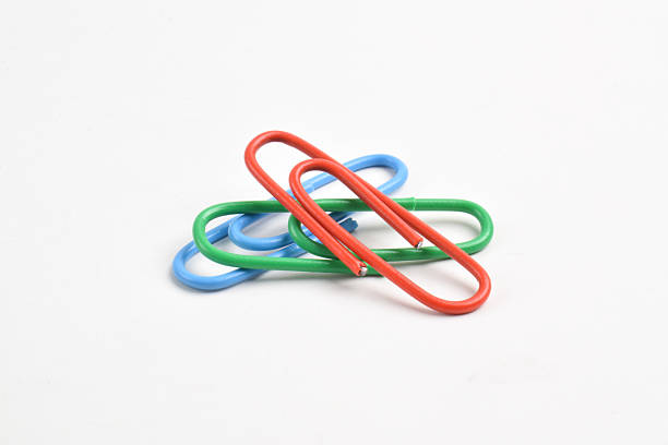 Many colorful paper clips isolated on white background