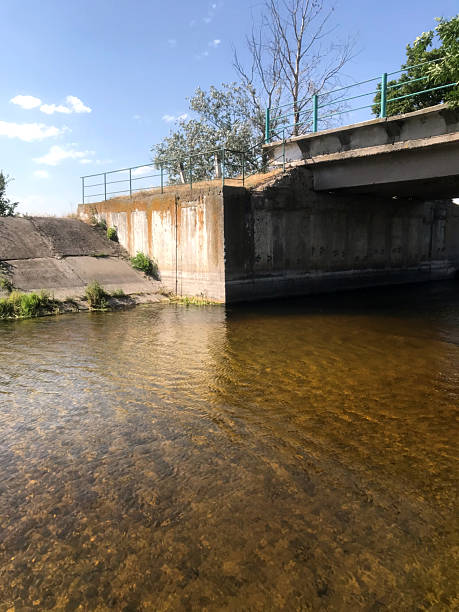 istock Picturesque river under a bridge on a sunny day 2225975006
