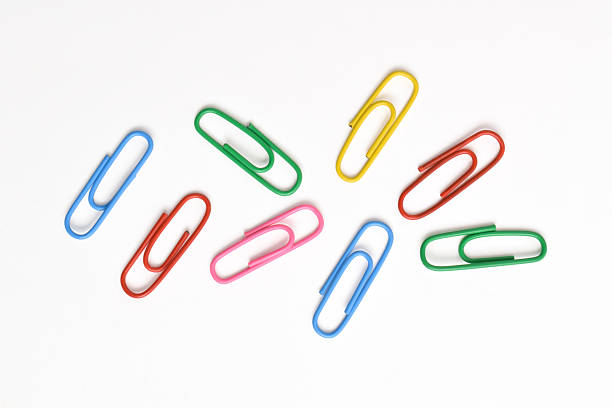 istock Colorful paper clips on white background 2225975378