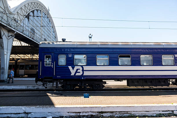Lviv, Ukraine - July 2, 2025: A passenger train departs the station in Lviv.