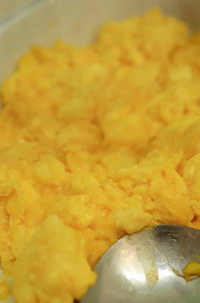 istock A Close Up Shot of Fluffy Scrambled Eggs with a Silver Spoon in a White Ceramic Dish Captures a Delicious Breakfast Scene 2225977809