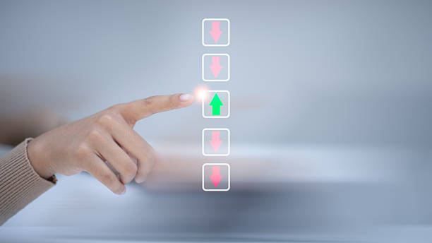 istock Hand pointing green arrow among red arrows in digital interface, symbolizing best choice, decision making, standout selection, leadership, and positive business direction. 2225978679
