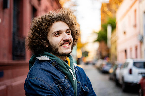 istock Young man looking away contemplating outdoors 2225987431