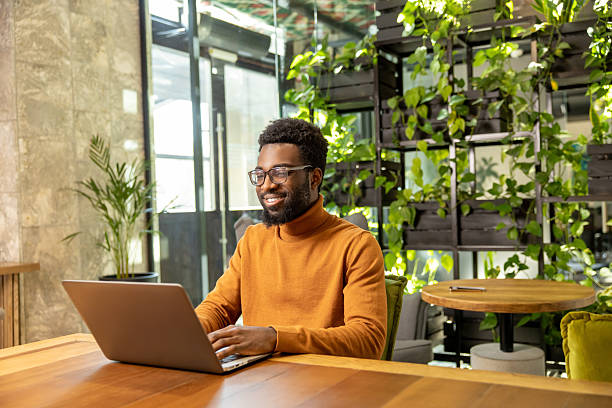 istock Adult man with short hair working on digital project from bright open office 2225991224
