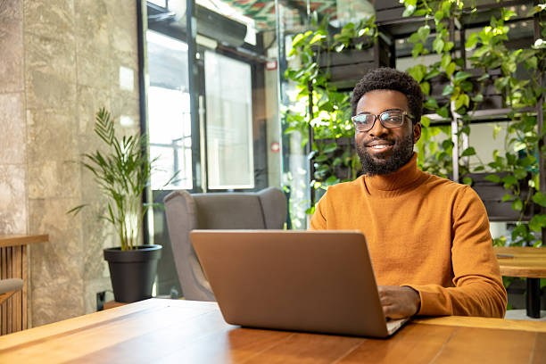 istock Adult man with short hair working on digital project from bright open office 2225991232
