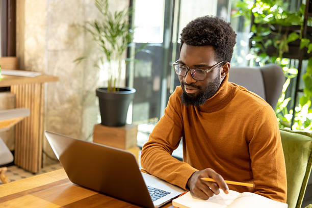 istock Entrepreneur man working from stylish workspace concentrating on virtual presentation 2225991329