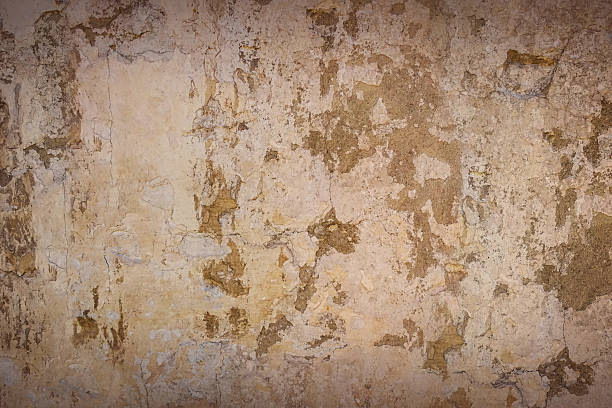istock Texture background with the image of orange old plaster with cracks, abrasions and stains over the old cement coating. 2225992019