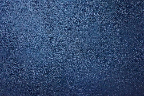 istock Background with an image of an old concrete wall painted with dark blue paint. The surface is cracked, old. 2225992151