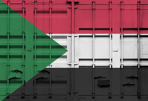 National flag of the state of Sudan close-up. State background. Flags.