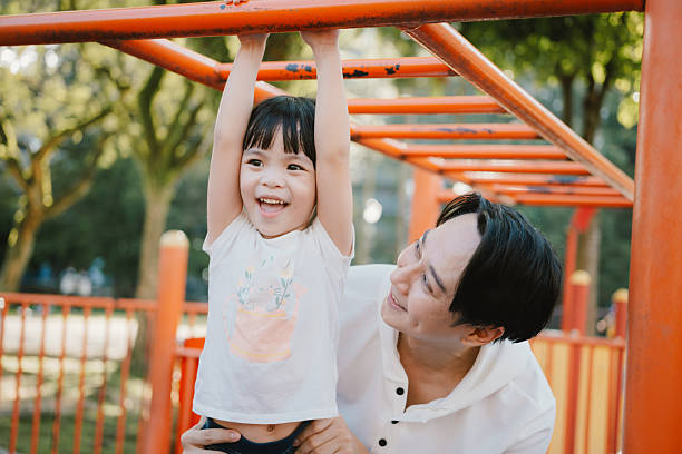 istock Happy Childhood Moments with Parental Support 2225993792