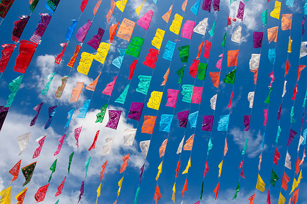 istock colorful flags against blue sky 2225994860