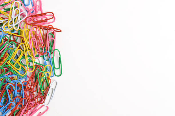 Colorful paper clips isolated on white background. Copy space. Copy space for your text and information