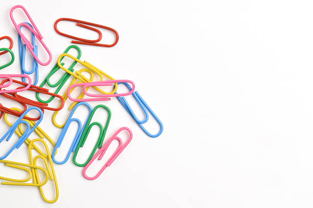 Colorful paper clips isolated on white background. Copy space. Copy space for your text and information
