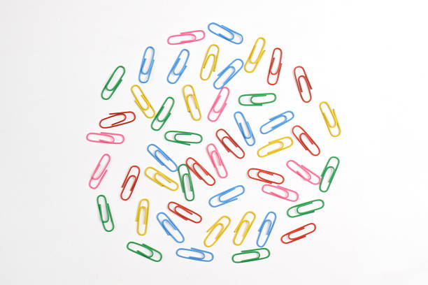 Colorful paper clips isolated on white background, flat lay, top view