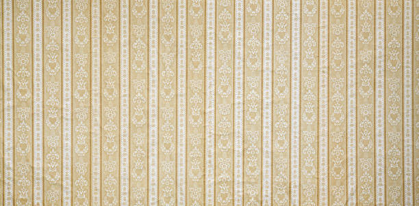 Old wallpaper on the wall. Old wallpaper for texture or background.