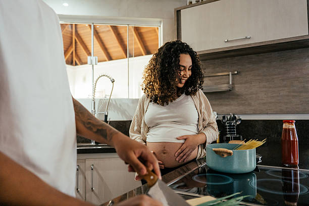 istock Couple preparing lunch together 2226003999