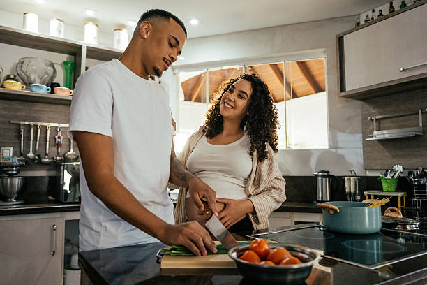 istock Couple preparing lunch together 2226004014