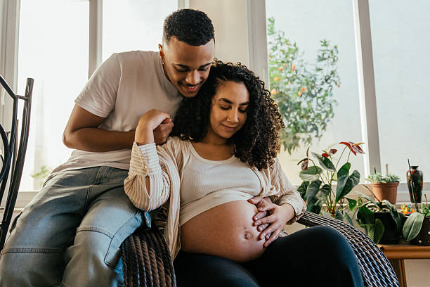 istock Father caressing pregnant woman's belly 2226004046