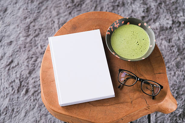 istock blank book cover mockup on coffee table with green matcha tea 2226005542