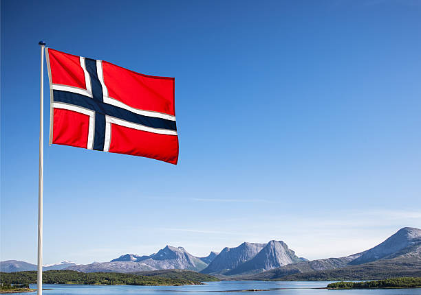 istock Norwegian national flag in front of blue sky 2226005652