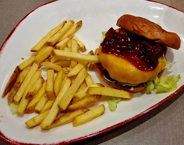 istock Yummy burger with fries 2226005716