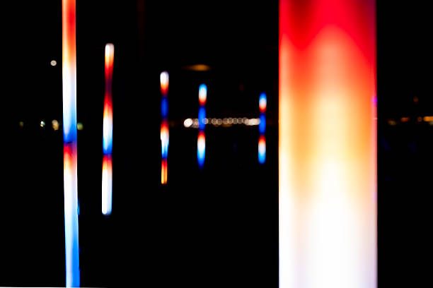 istock Mesmerizing scene of a glowing blue cube and illuminated pillars in a dark space at night, creating a captivating atmosphere 2226006621