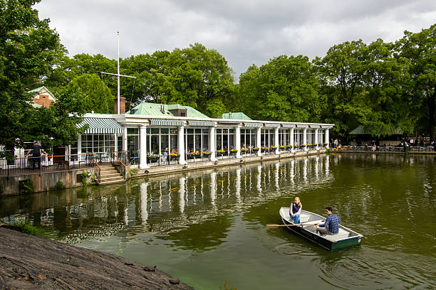 New York, New York, USA May  24, 2025 A rowboat with a couple at the The Central Park Boathouse and restaurant in Central Park.