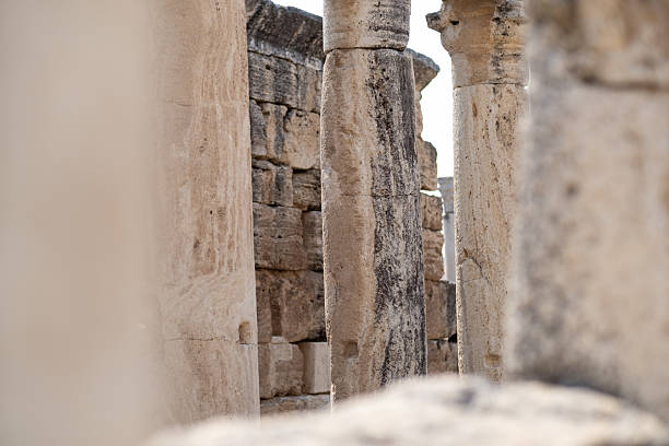 istock Explore the Ruins of Pamukkale, an Ancient Site Featuring Impressive Stone Columns and Historical Architecture Surrounded by Natural Beauty 2226010229