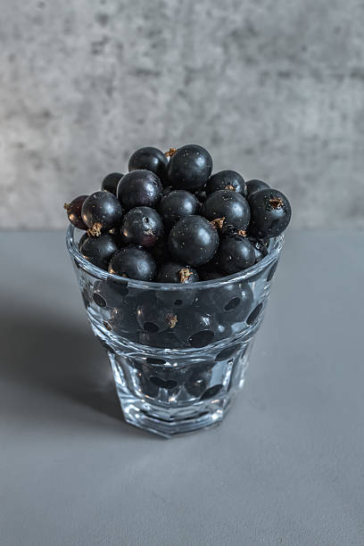 istock Glass filled with ripe blackcurrants 2226010254