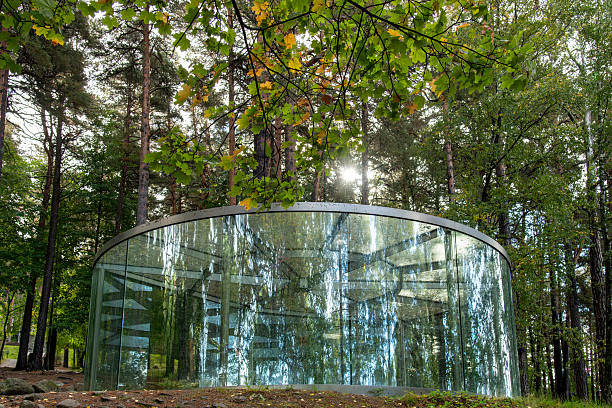 Oslo, Norway-25 September 2024; Low angle view of Ekeberg Pavilion of glass, metal and stone by artist Dan Graham in Ekebergparken Sculpture Park