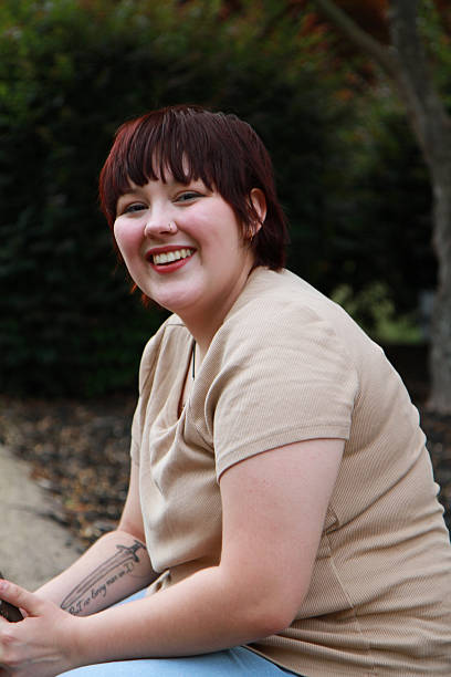 istock Beautiful College Student Smiling and Looking at Camera 2226019325