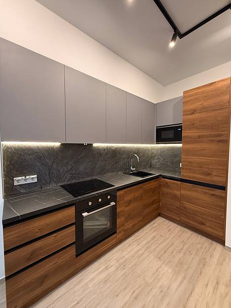 istock Modern Kitchen Interior with Wood and Gray Cabinets 2226021592