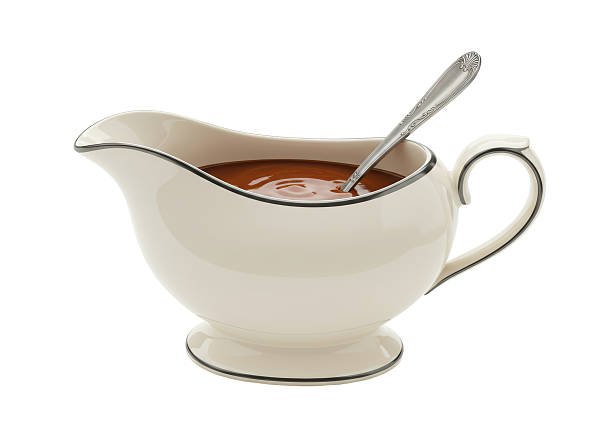 Isolated Gravy Boat with Spoon and Sauce