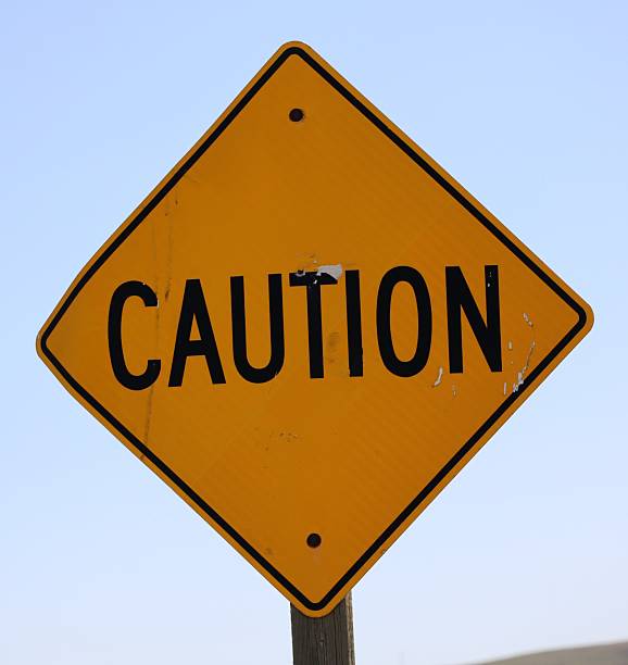 istock A diamond shaped yellow traffic caution sign. 2226032137