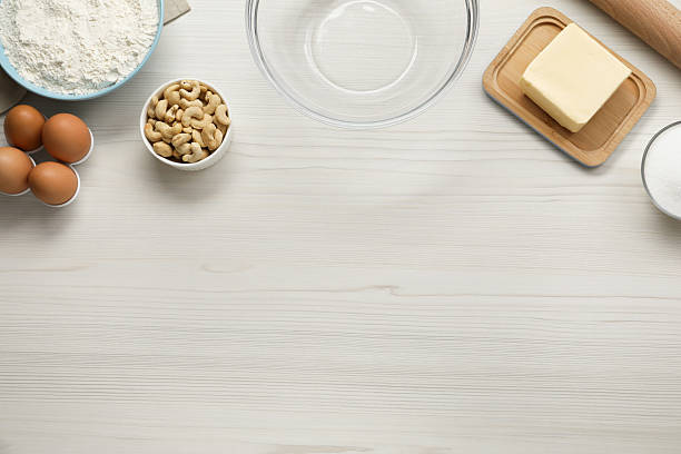 istock Different ingredients for cookies on white wooden table, flat lay. Space for text 2226032284