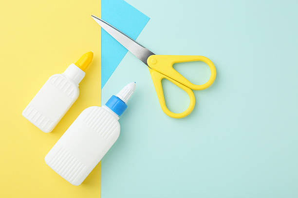 istock Glue, colorful paper and scissors on turquoise background, flat lay. Space for text 2226034000
