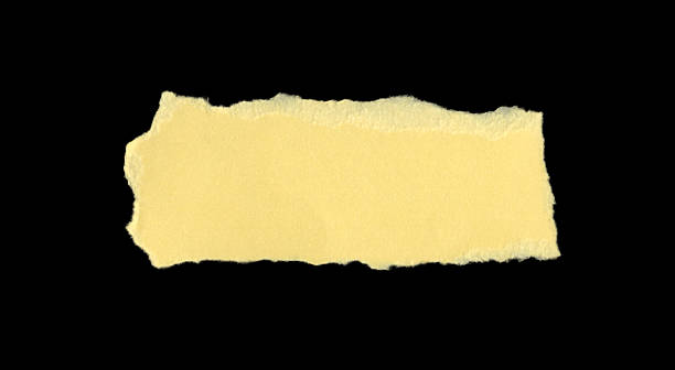 istock Jagged yellow paper cutout with rough edges. Great for mixed media, sticker design, or message highlights. The paper's texture and color provide a distinct contrast that can draw attention in visual compositions. 2226036875