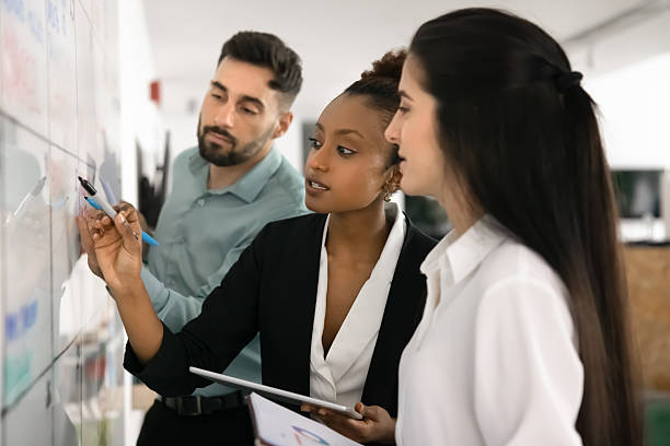 Diverse workmates working together on business plan