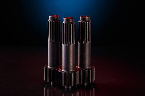 istock Three metallic shafts stand in a row on a dark surface 2226043741