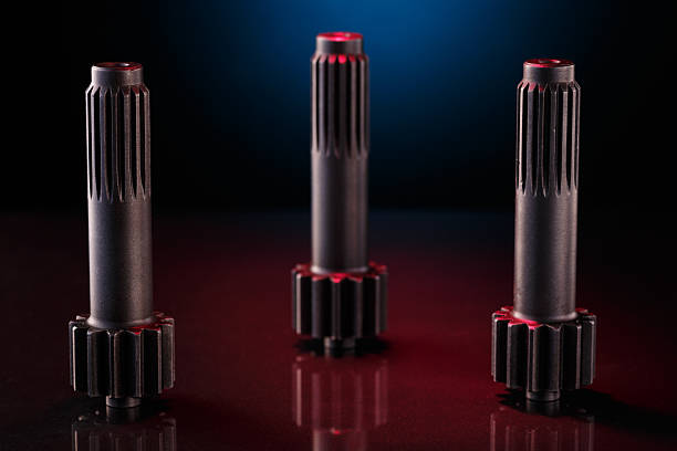 istock Three metallic shafts stand in a row on a dark surface 2226043749