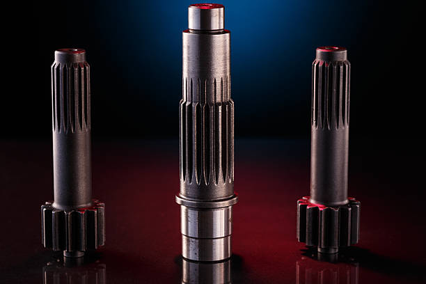 istock Three metallic shafts stand in a row on a dark surface 2226043755