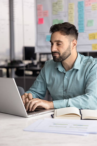 istock Hispanic man researching information related his task or project details 2226047064